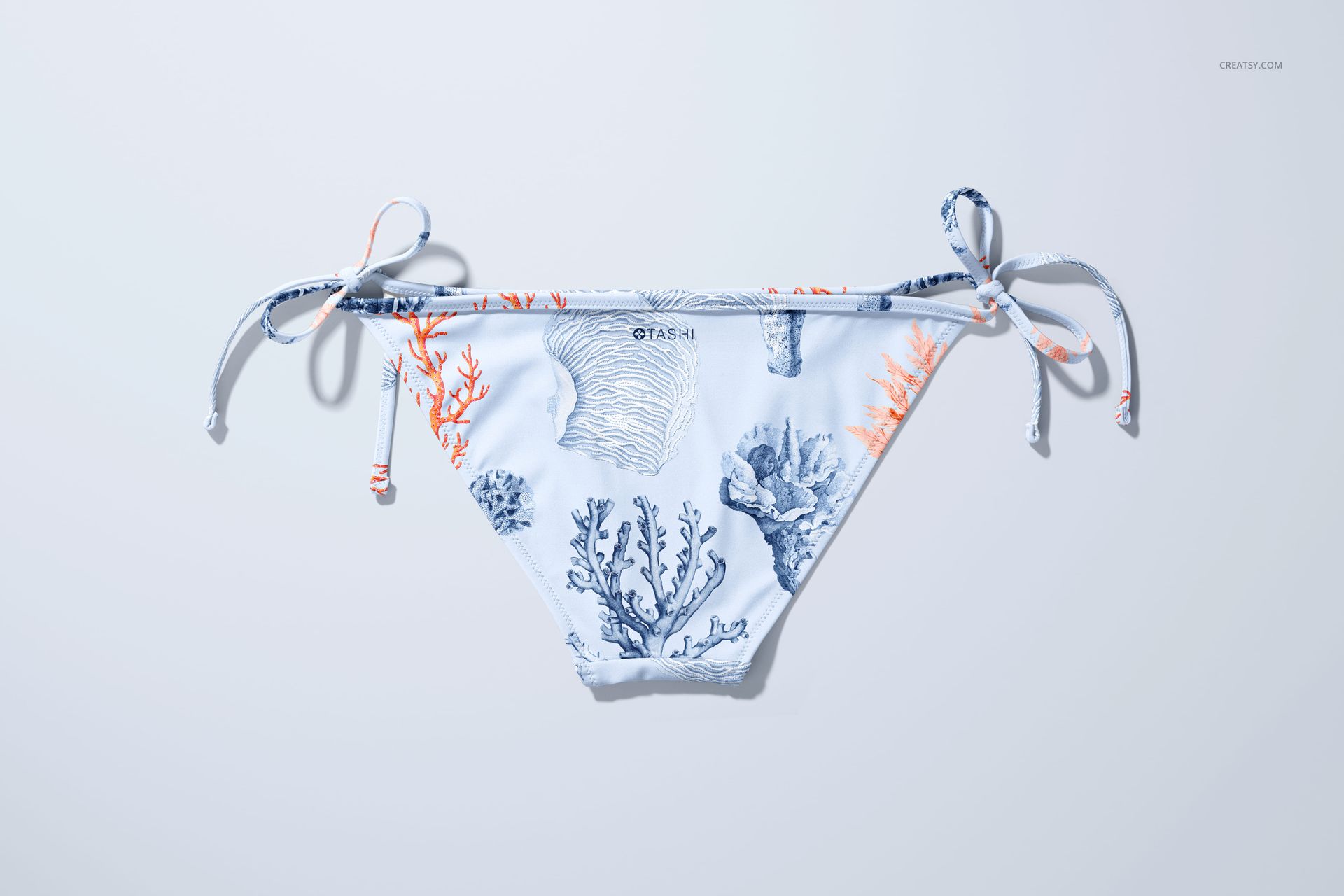 Bikini bottom mockup featuring a sea-inspired pattern in blue and orange tones, shown from a top-down perspective.