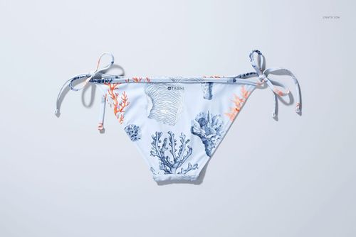 Bikini bottom mockup featuring a sea-inspired pattern in blue and orange tones, shown from a top-down perspective.