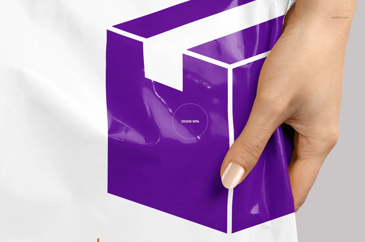 PSD mockup of a glossy white mailing bag with purple box artwork, displayed from the front and held by a person’s hand.