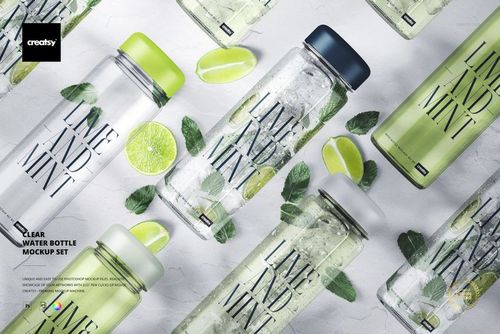 PSD mockup of transparent water bottles with various colored caps, lime and mint motifs, and scattered citrus props.