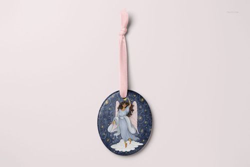 Oval-shaped Christmas ornament mockup featuring an angel illustration on a dark blue background, front view.