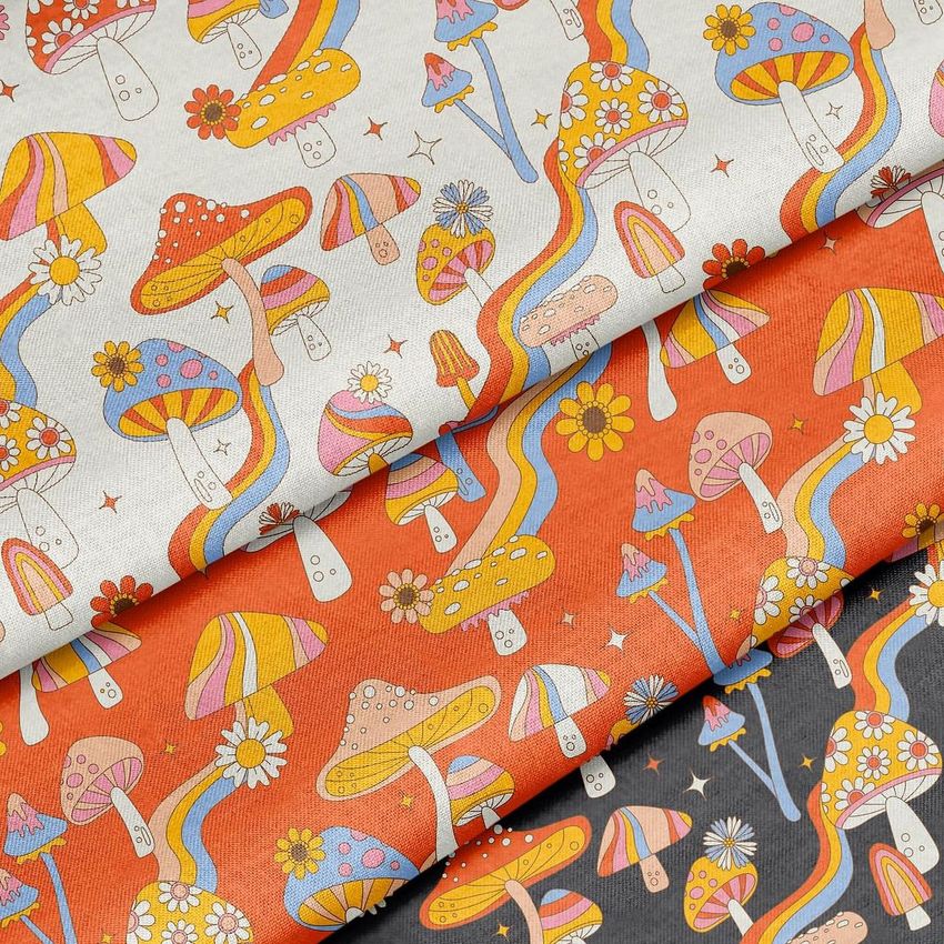 Close-up of patterned fabric mockup showing playful mushrooms and daisies in bright, multicolored designs.