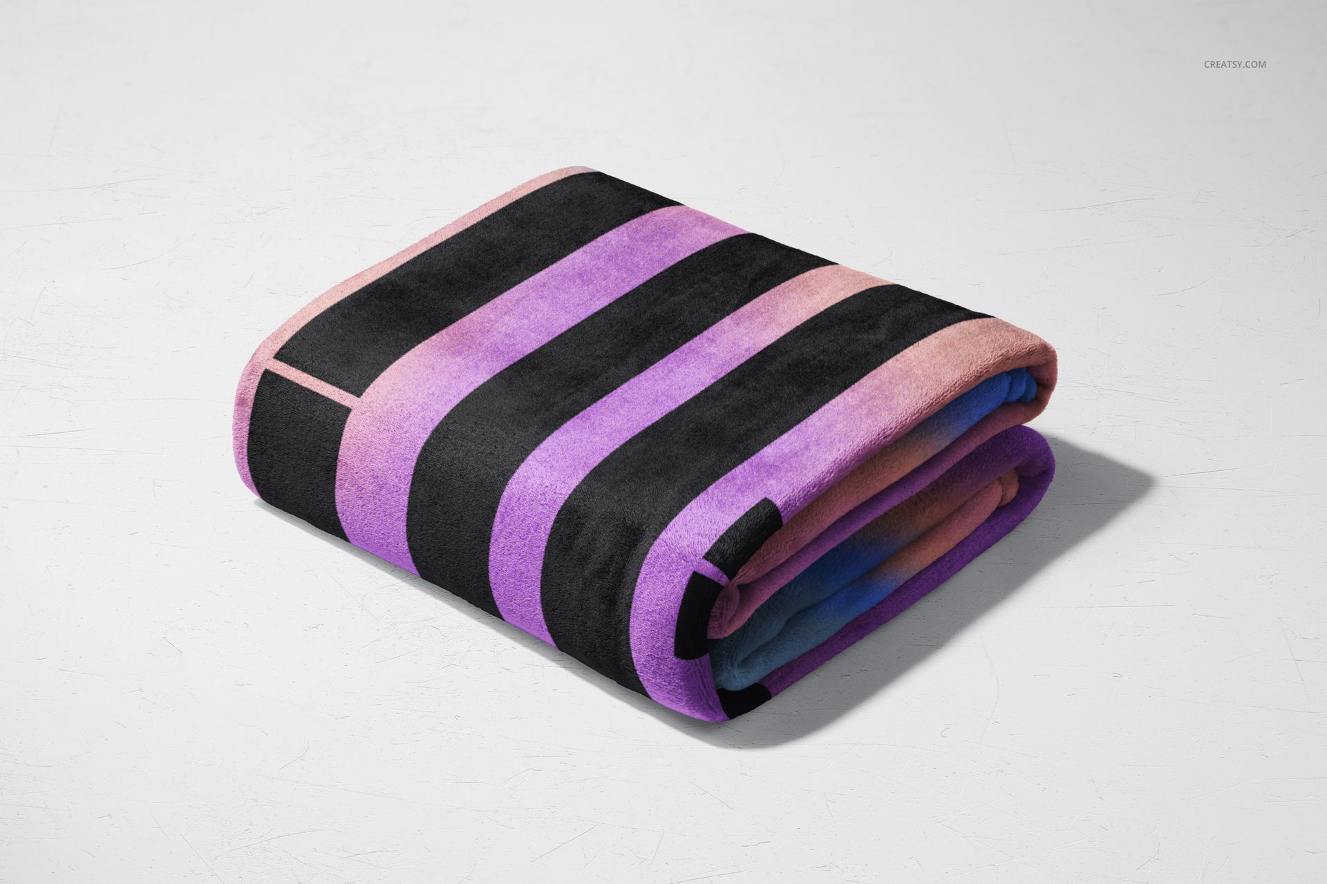 Fleece blanket mockup showing a folded blanket featuring wide black, purple, and pink stripes on a plain background.