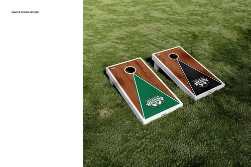 Cornhole board mockup set featuring two boards with distinct green and black triangle patterns on a grassy field.