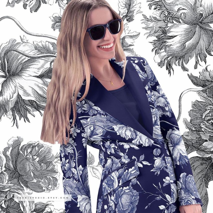 Adult apparel mockup featuring a two-piece suit with bold white floral designs on dark blue fabric, posed against a floral sketch background.