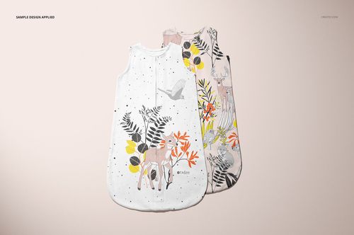 PSD mockup showing a pair of baby wearable blankets with colorful forest-themed designs arranged side by side.
