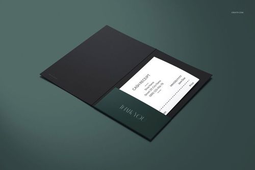 Receipt holder mockup featuring a dark folder with an inserted white cash receipt, shown from a top angle on a green surface.