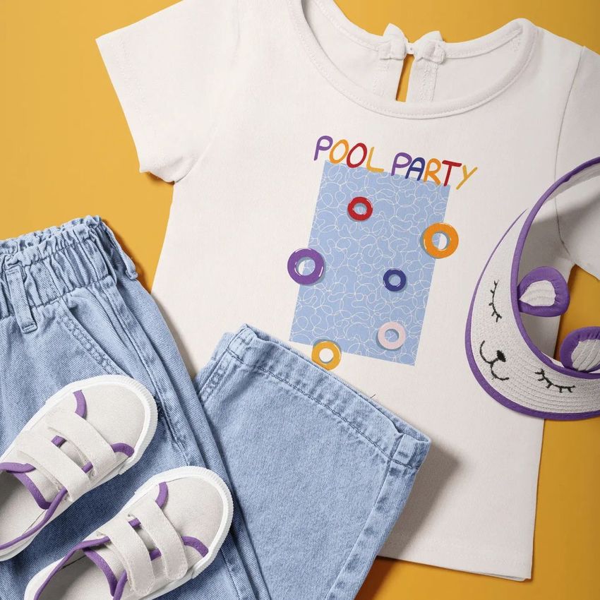 Kids t-shirt and jeans mockup set arranged on a yellow background with white sneakers and a playful animal-themed eye mask.