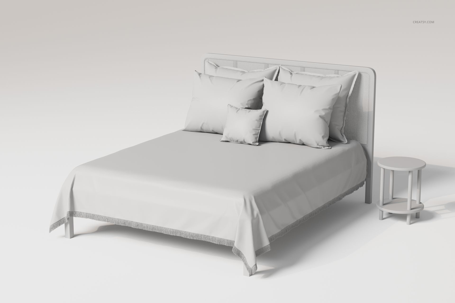 Front view of a rattan headboard bed with a fringed bedspread, large pillows, and a round bedside table in a neutral setting.
