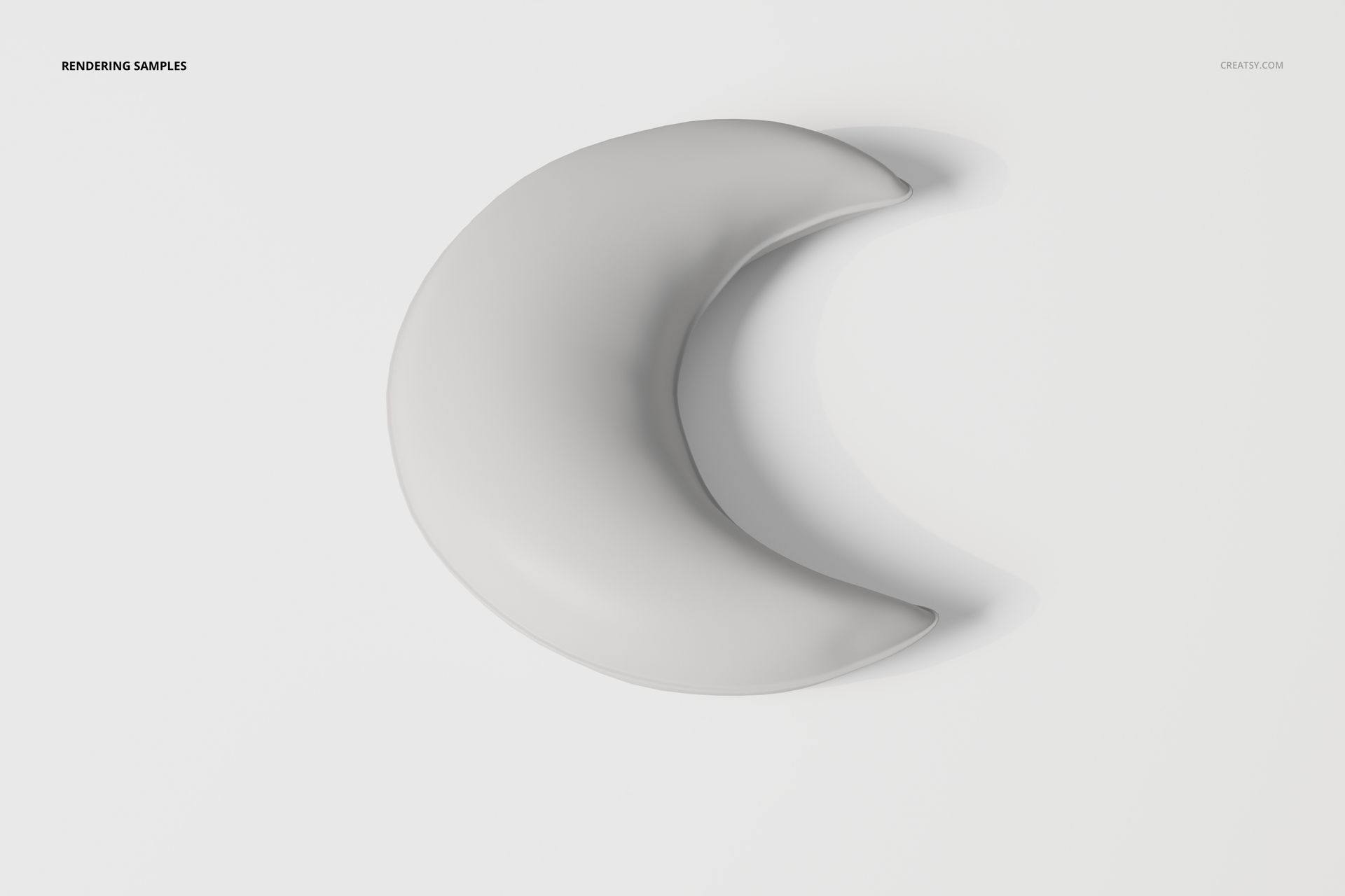 Crescent moon-shaped pillow in light gray fabric, viewed from above against a plain white background.