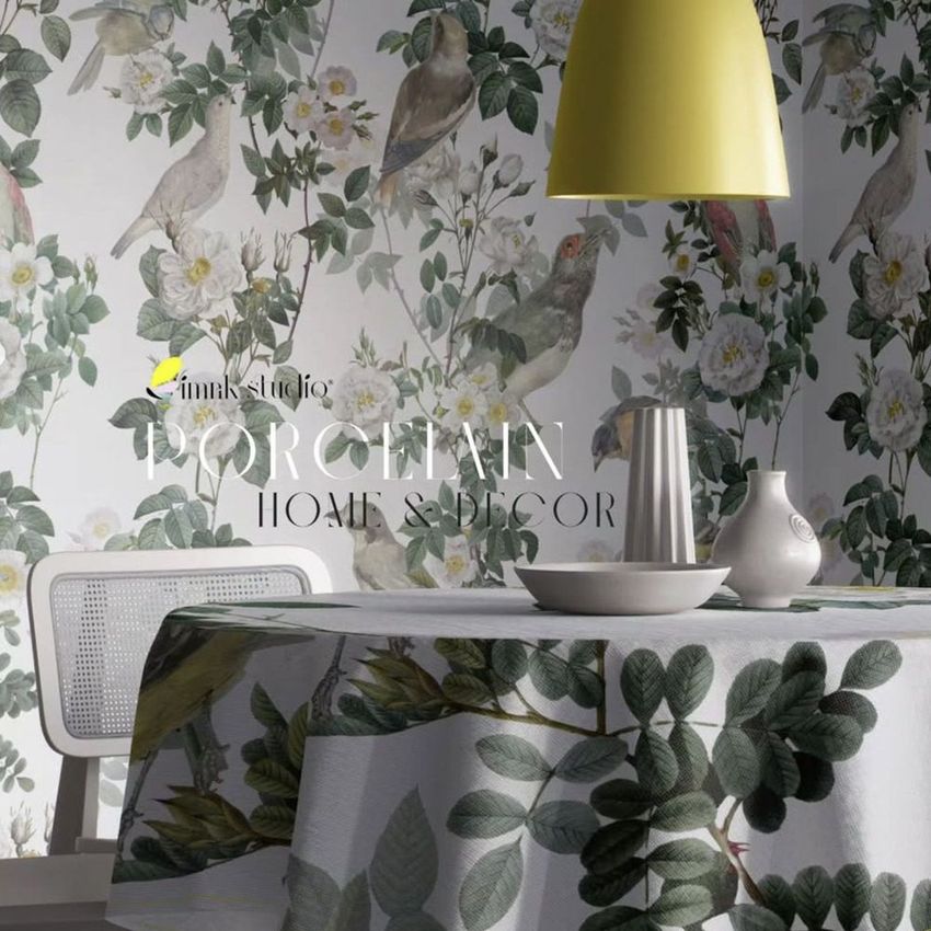 Dining room tablecloth mockup featuring leafy botanical patterns, set with ceramic vases under a yellow pendant lamp.