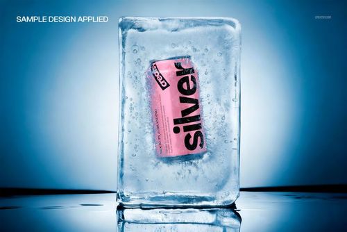 PSD mockup featuring a drink can trapped in a rectangular ice block, highlighted by cool blue tones and reflections.