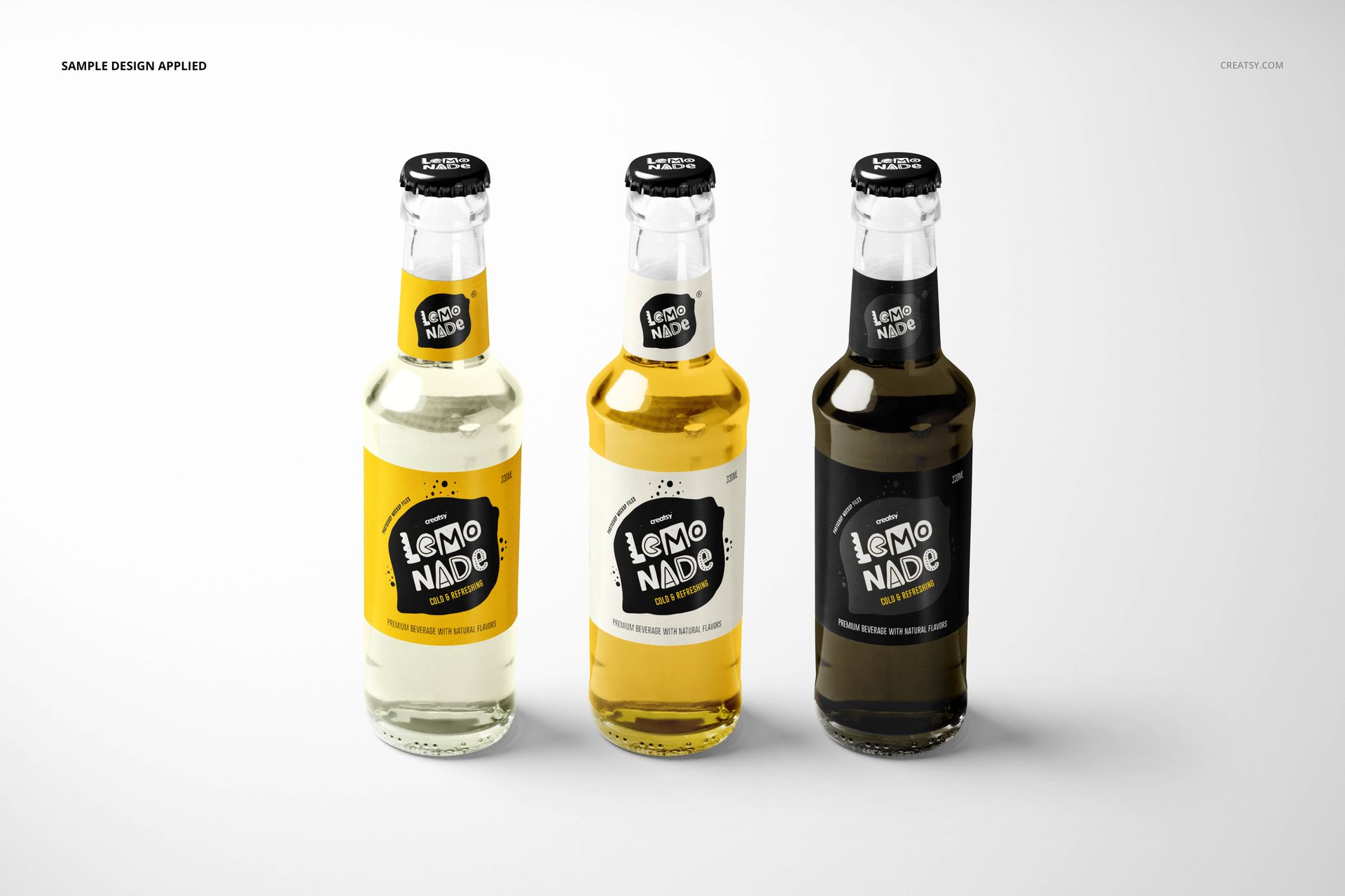 PSD mockup showing trio of lemonade bottles in varying shades, arranged side by side on a light surface.