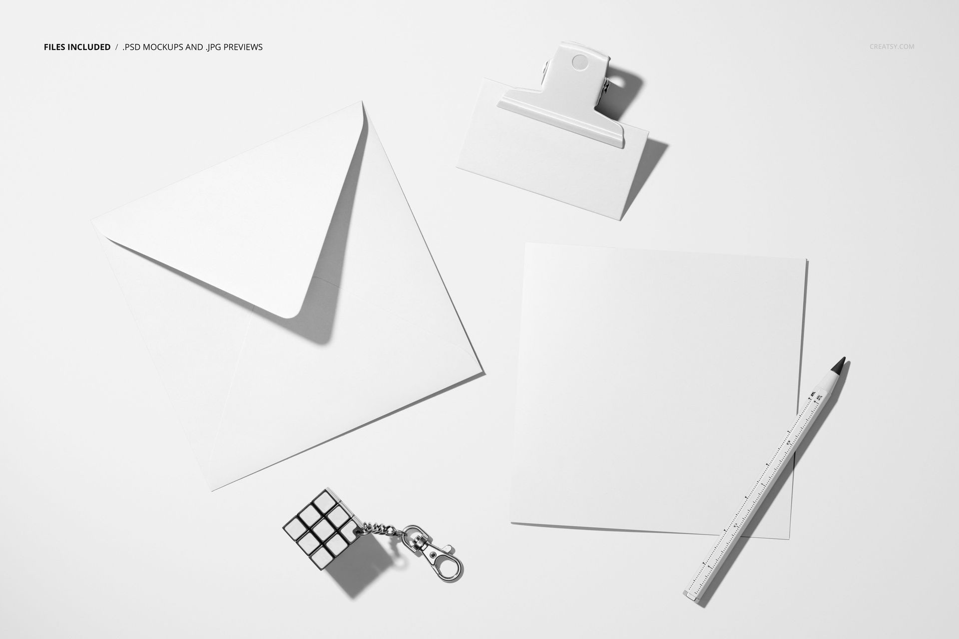 Square greeting card and business card mockup featuring white stationery items on a clean, light background, top view.