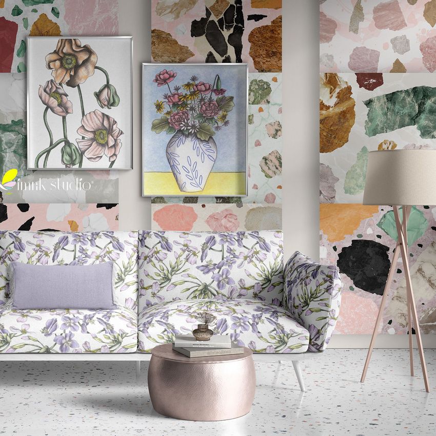 Interior scene mockup showing a floral-patterned sofa with a lavender pillow, abstract wallpaper, and two framed art prints above.