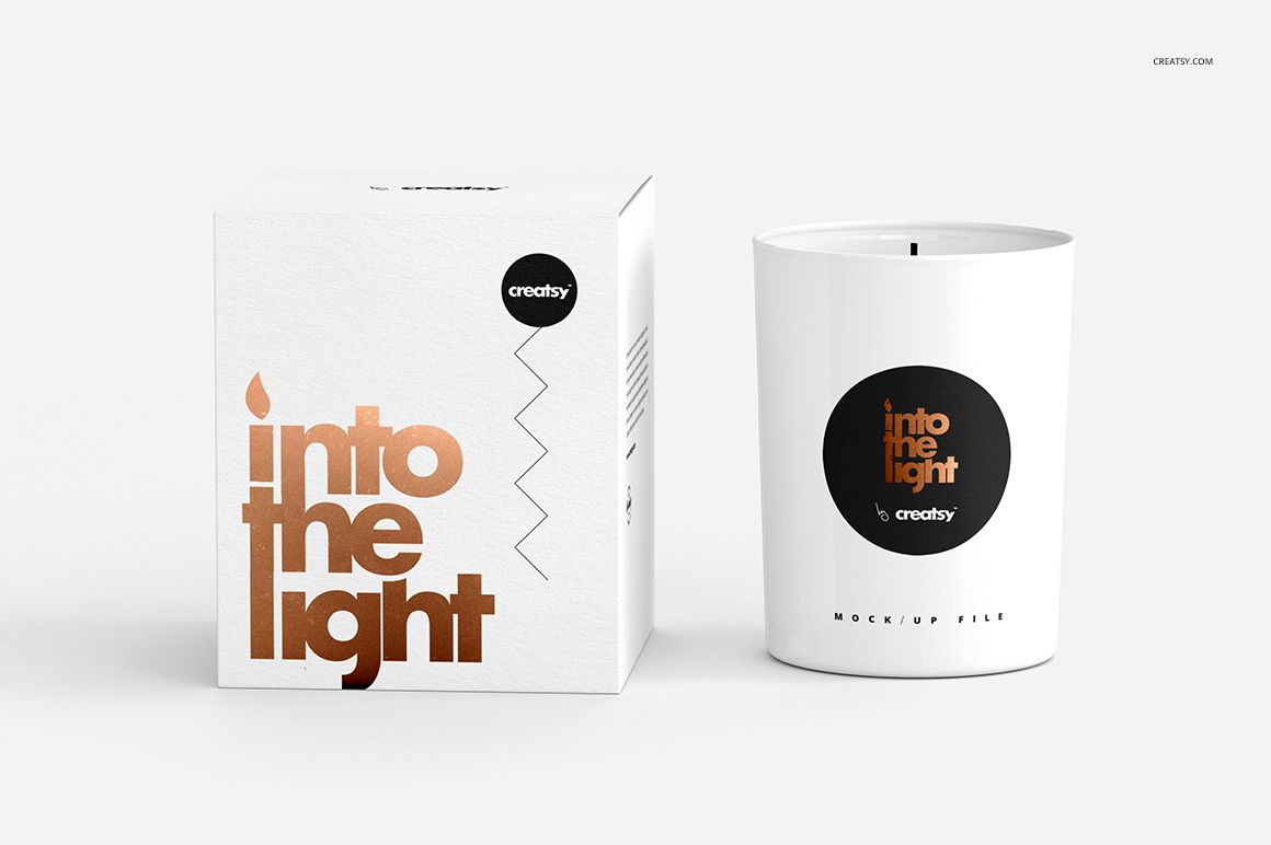 Scented candle mockup set showing a cylindrical white candle and square box with bold graphic labels and foil accents.