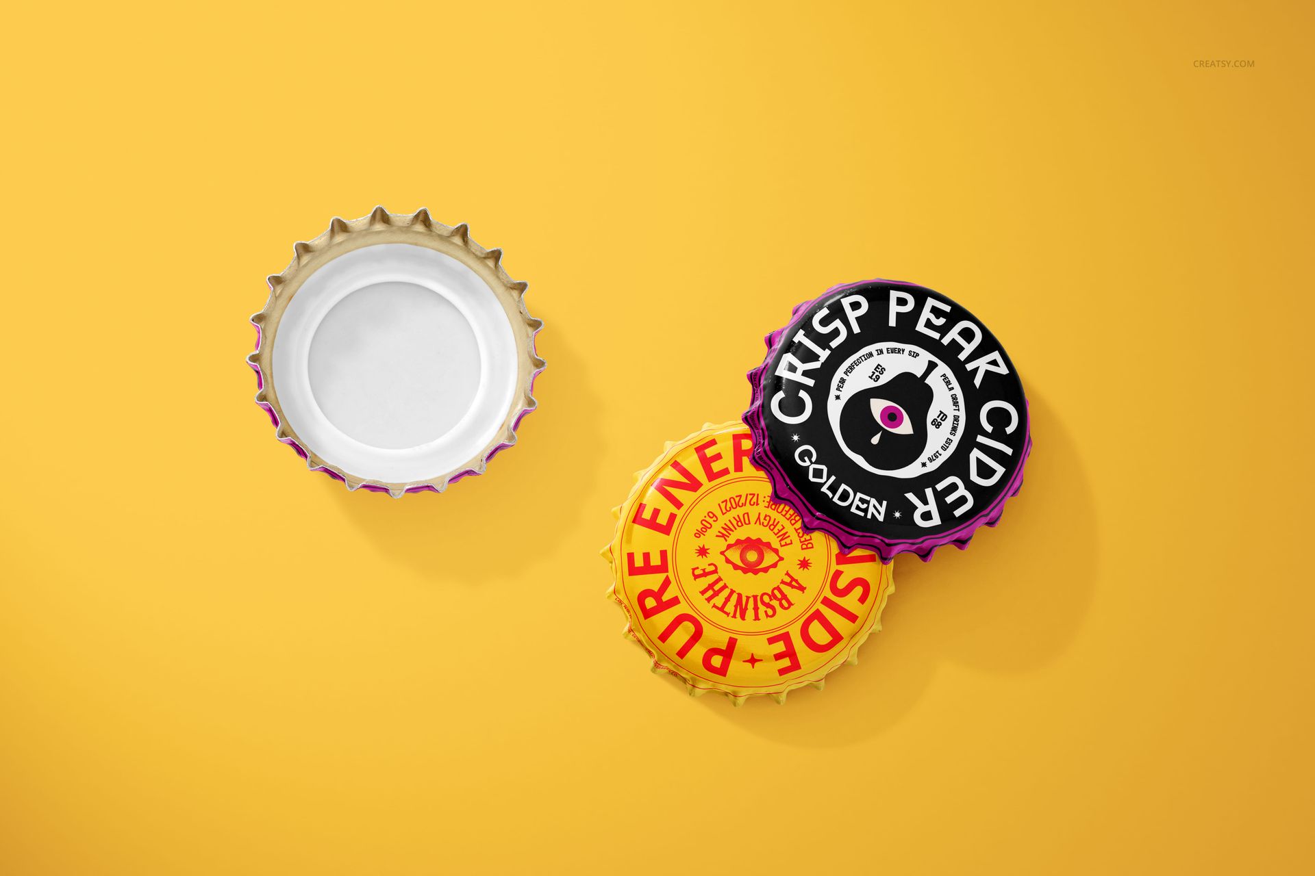 Bottle cap mockup set showing two colorful branded caps and one blank cap on a solid yellow surface from above.