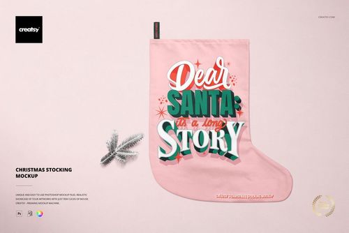Christmas stocking mockup with a pink fabric, bold festive lettering, and a small silver pine branch on a light background.