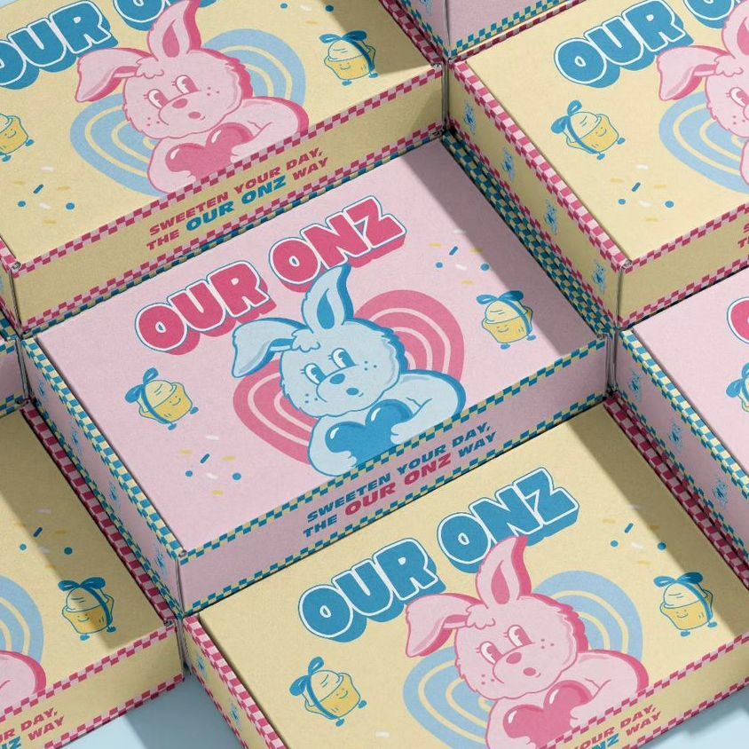 Mailing box mockup featuring pastel-colored boxes with cartoon bunny illustrations, bold text, and heart motifs in a stacked layout.