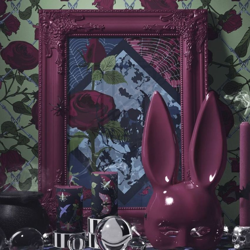 Halloween picture frame mockup featuring a dark ornate frame with floral art, surrounded by candles, a cauldron, and a rabbit sculpture.