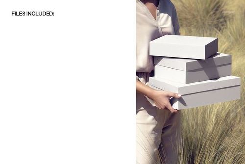 PSD mockup showing three blank box packages held in arms, outdoor setting with beige grass and soft sunlight.