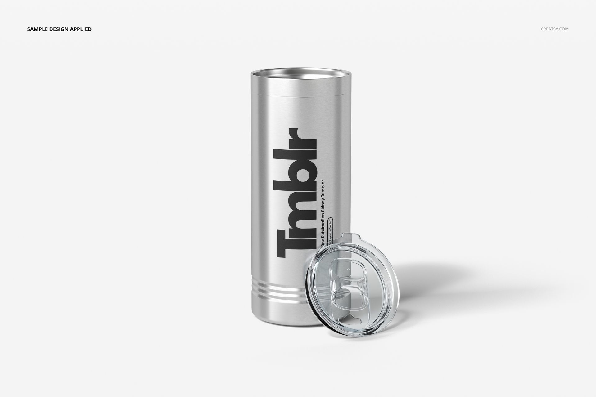 22oz stainless steel tumbler mockup with bold text design, accompanied by a clear plastic lid, front perspective.