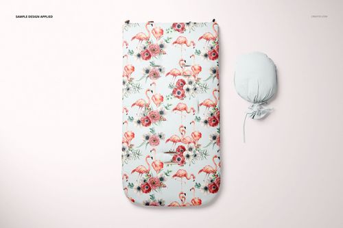 Front view of a baby sleeping bag mockup with a floral and flamingo pattern, next to a tied sleeping bag on a light background.