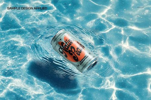 Drinkware mockup showing a silver can with custom artwork drifting on rippling water, top perspective in sunlight.