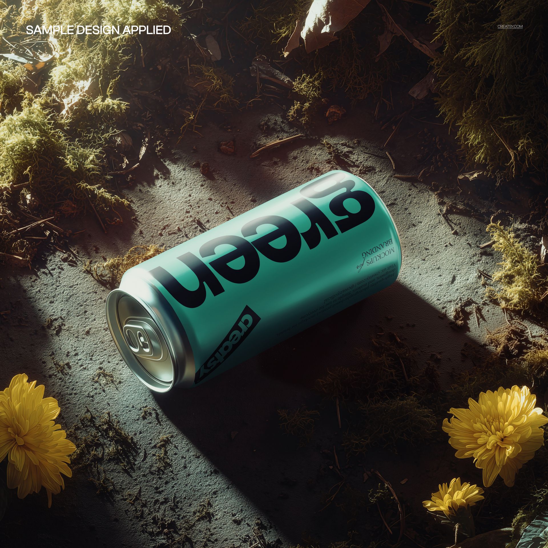 Nature-themed beverage can mockup lying on its side, surrounded by moss and yellow flowers in a soft light.
