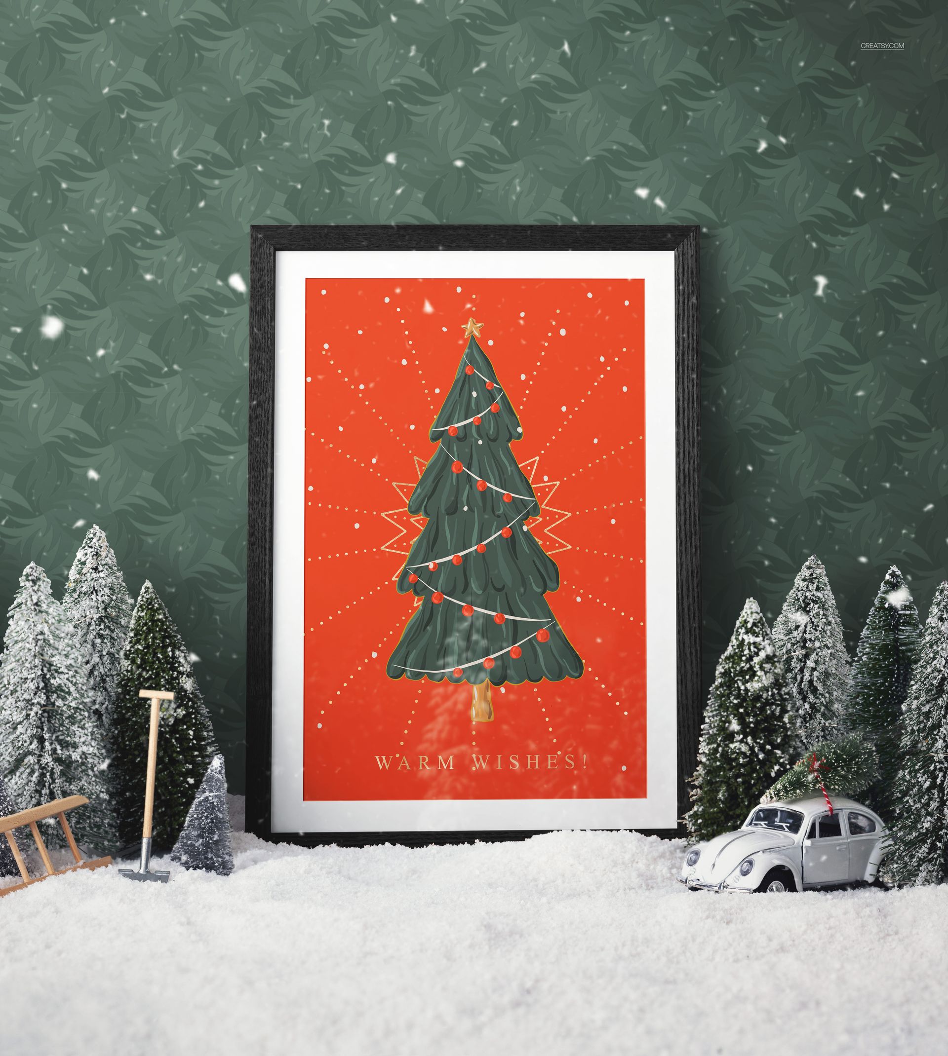 Framed Christmas tree illustration with warm wishes text, set against a red background, surrounded by snowy trees.