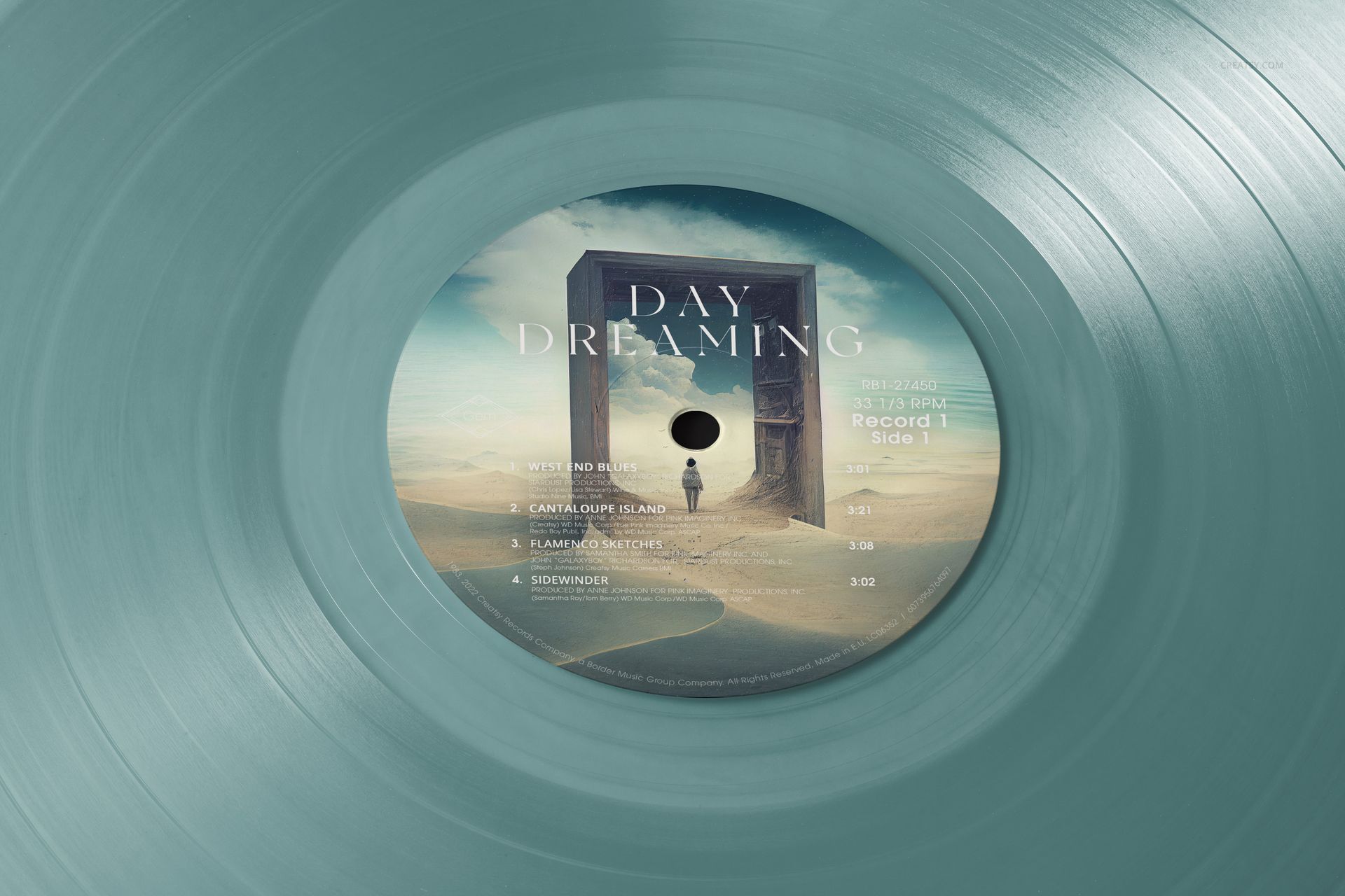Close-up of a colored vinyl record mockup showing a label with a desert scene and a solitary figure by an arch.