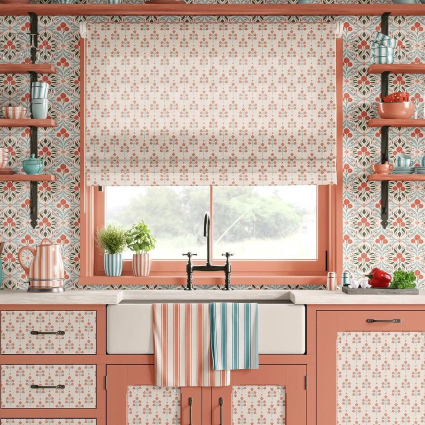 Provence style kitchen mockup showing a farmhouse sink, patterned curtains, and pink cabinetry with floral wallpaper.
