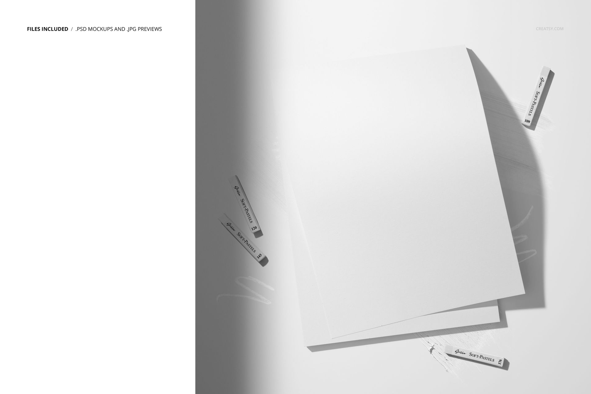 PSD mockup featuring several white pastel sticks and blank decorative paper sheets in a minimalist, overhead scene.