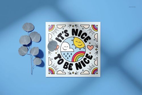 PSD mockup of a square stationery card with cheerful clouds, sun, and rainbow designs, next to dried leaves on blue.