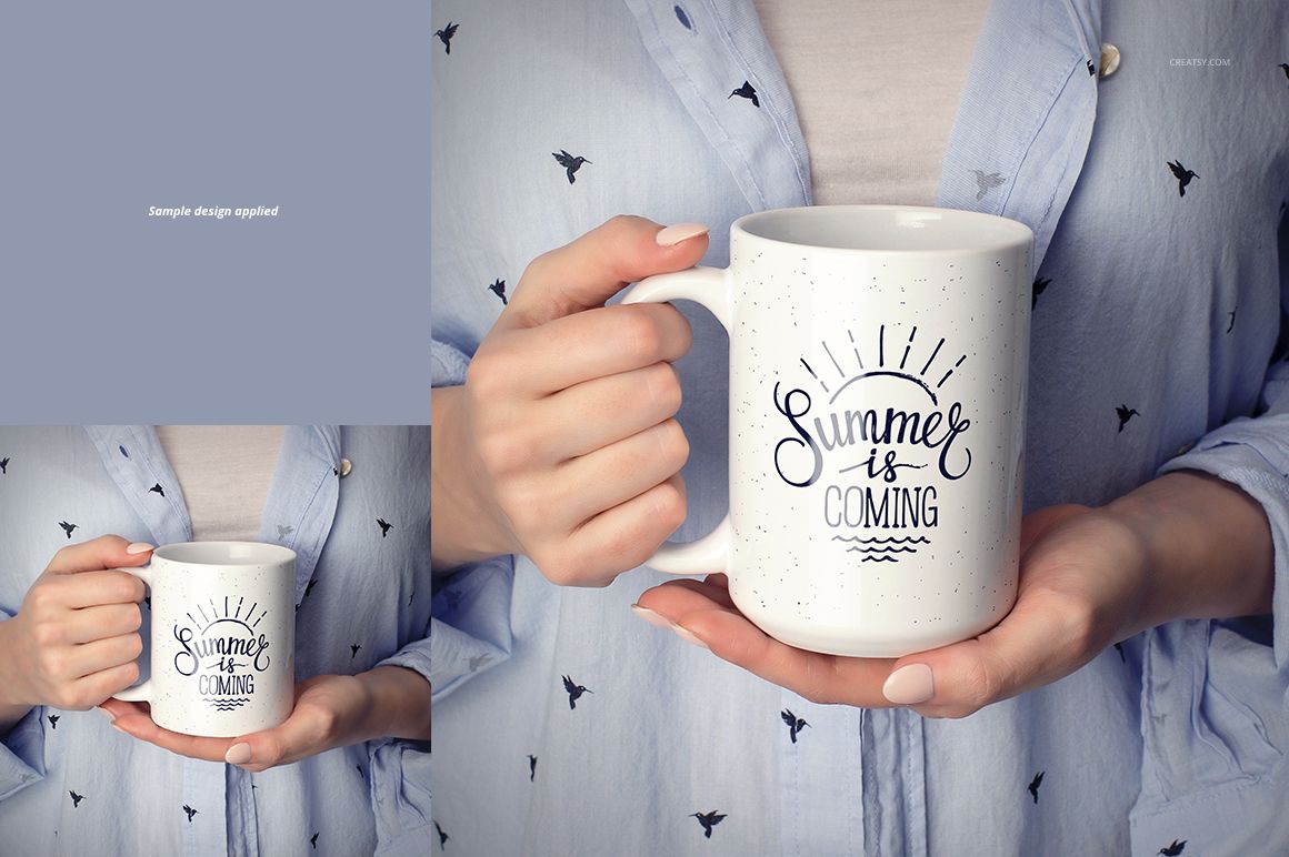 Front view of a person holding a white ceramic mug with a summer-themed design, wearing a blue shirt with bird patterns.