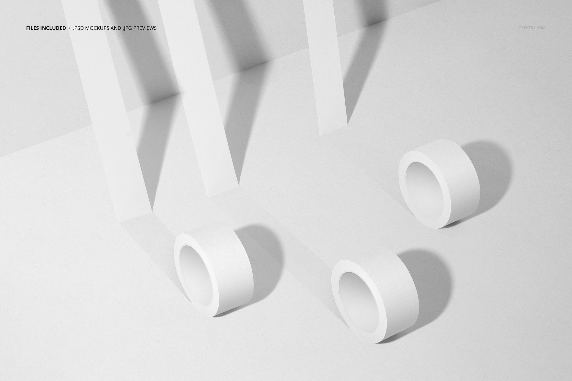 Minimalist scene with three packaging tape rolls and bent tape strips, displayed as a PSD mockup on a white surface.