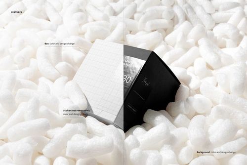Square box mockup with customizable design, half white grid pattern and half black, nestled in white packaging peanuts.