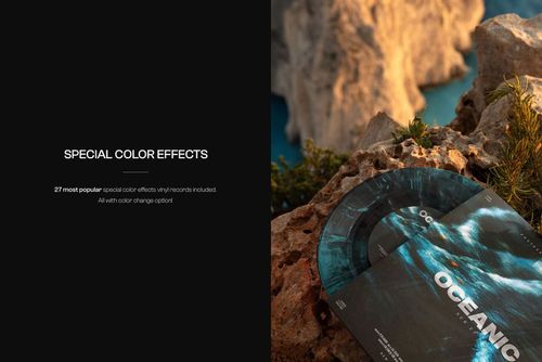PSD mockup featuring a vinyl record with a blue abstract design, set on textured rocks with blurred background scenery.