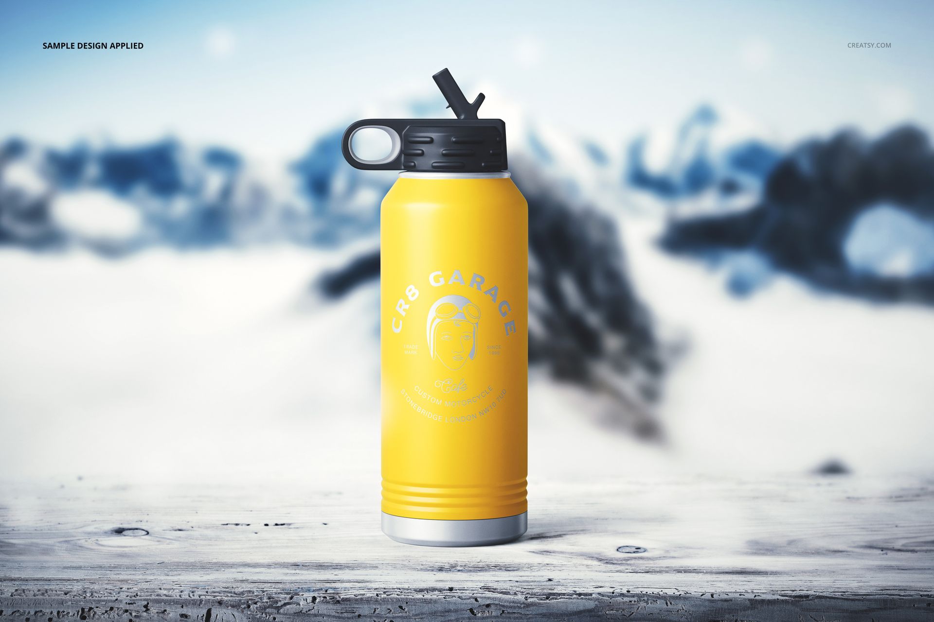 Front view of a yellow 32 oz. water bottle mockup with black top, placed on a snowy surface against a wintry background.