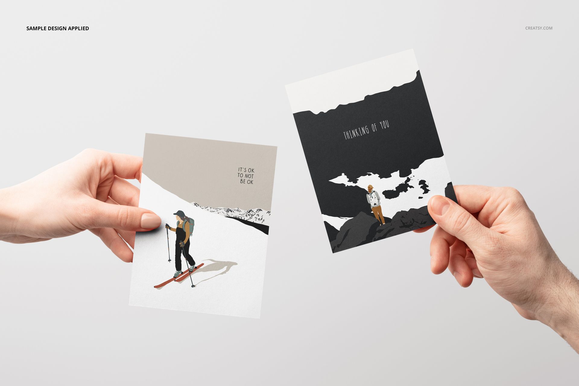 Front view of two A2 cards mockup, each held by a hand, featuring minimalist outdoor-themed illustrations.