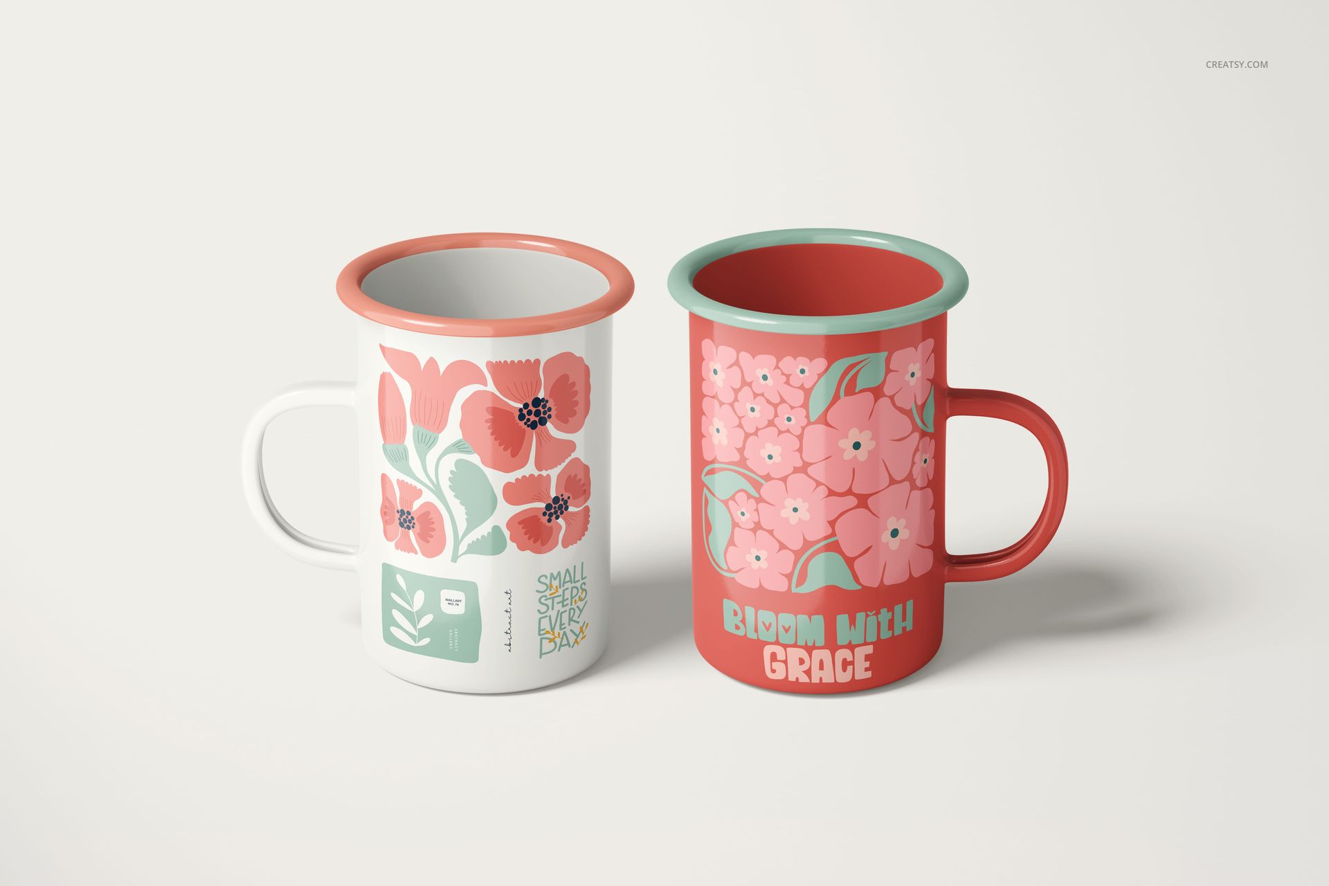 PSD mockup of enamel mugs with botanical illustrations, one in white and one in coral, placed next to each other.