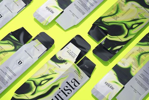 Multiple dropper bottle packaging mockups featuring swirling green and black designs arranged in a flat lay style.