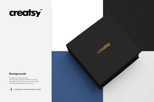 Jewelry box mockup in matte black with gold lettering, positioned diagonally on a blue and white surface.