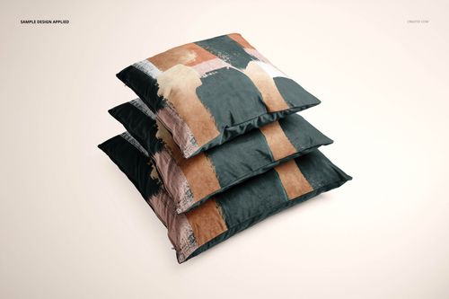 Front view of a PSD mockup displaying three stacked cushion covers with bold geometric patterns in dark and neutral shades.