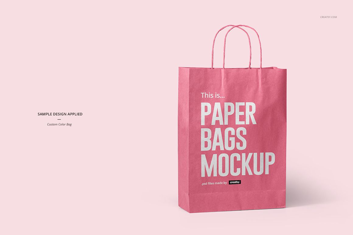 Front view of a pink paper bag with twisted handles, displayed on a light pink background as a packaging mockup.