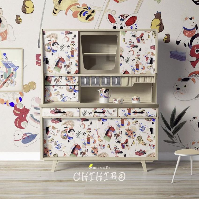 Kitchen cupboard mockup with colorful luxury pattern featuring playful animal and object illustrations on doors and drawers.