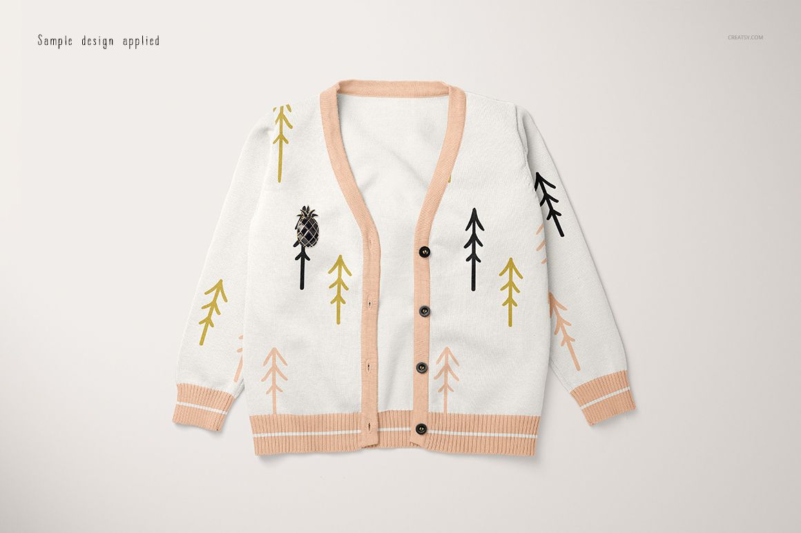 Baby cardigan sweater mockup in white with peach trim, featuring simple tree patterns in black and yellow, front view.