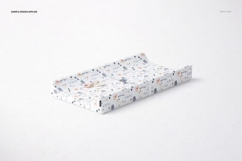 PSD mockup of a rectangular changing pad with contour shape, decorated with small animal illustrations and soft colors.