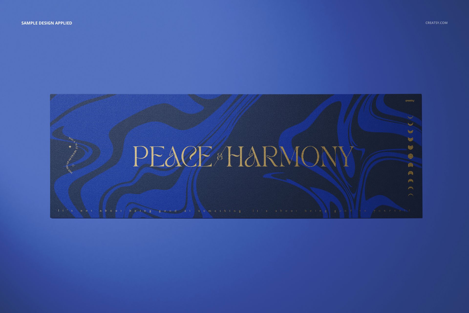 Yoga mat mockup featuring abstract blue swirls and gold lettering, displayed flat against a solid blue background.