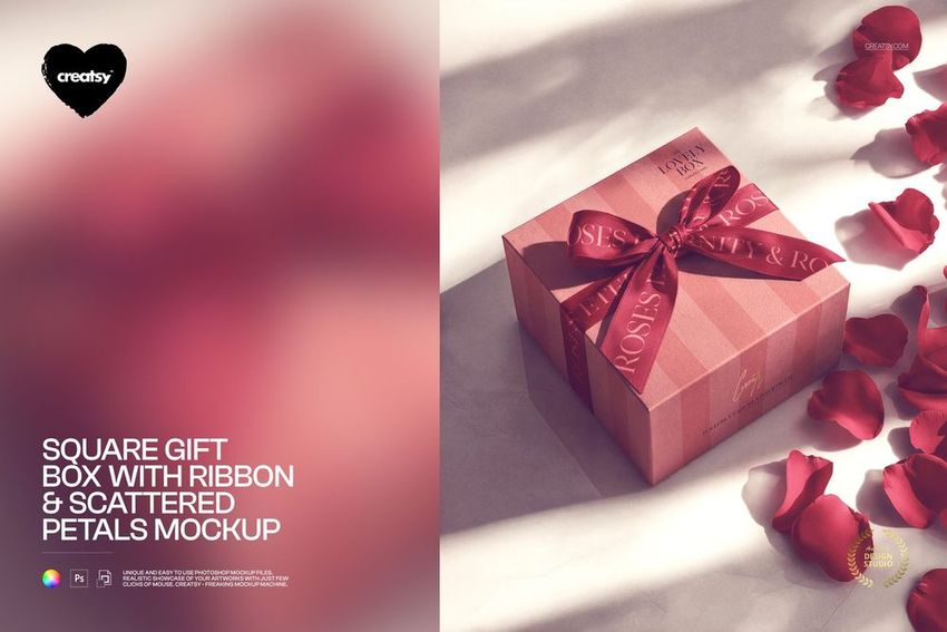 PSD mockup of a square gift box featuring a red ribbon and rose petals, top view with petals around the box.